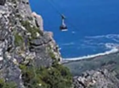 a boat in the water on a mountain at WhiteSands in Cape Town