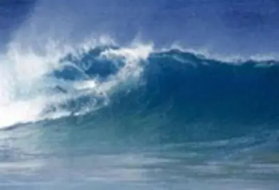 a large wave in the ocean on a cloudy day at WhiteSands in Cape Town