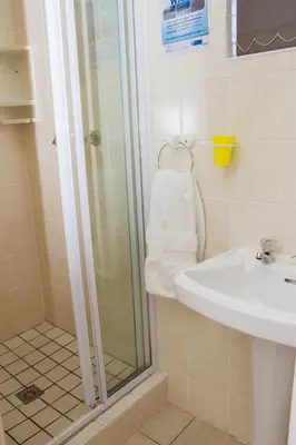 a bathroom with a sink and a shower at Helderzicht Self-Catering in Brackenfell