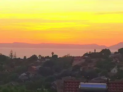 a view of a city at sunset at The Room in Cape Town