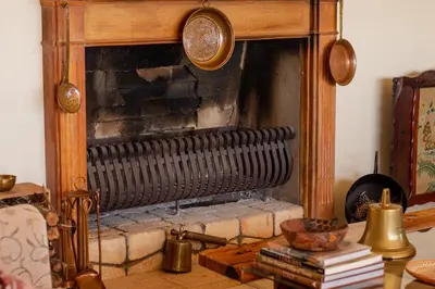 a fireplace with a wooden frame in a living room at Casa Mori House in Stellenbosch