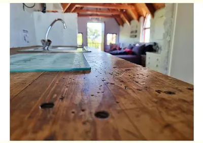 a wooden counter top with a sink in a kitchen at Studio on McLeod - Private Self-catering Apartment in Somerset West