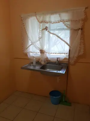 a bathroom with a sink and a window at Canterbury Self-catering in Bellville