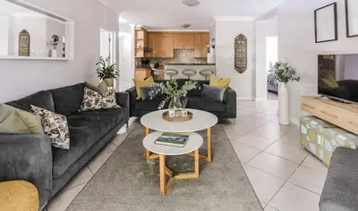 a living room with a couch and a table at Casa Bella Stellenbosch - Jan Cats No 4 in Stellenbosch