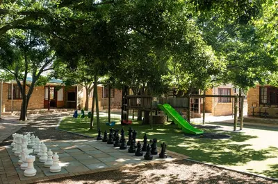 a park with a chess board and a playground at De Hollandsche Molen in Hou Moed