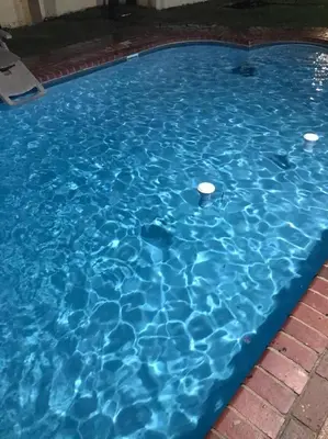 a blue swimming pool with blue water at Robert's Place Paarl in Paarl