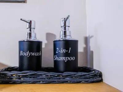 two bottles sitting on top of a table at Worcester the Karoo Guest Room in Worcester