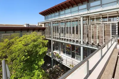an external view of a building with a balcony at Atlantic Blue Villa at Pilots in Cape Town