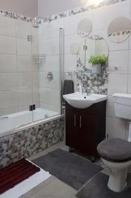 a bathroom with a sink and a toilet and a shower at The Vintage Crane Guest House in Caledon