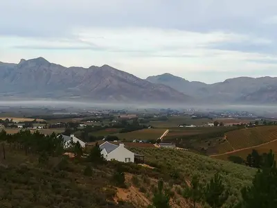 a view of a valley with mountains in the background at Vredehoek Guest Farm in Breerivier