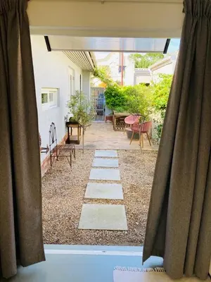 a view of a patio from a window at Modern studio apartment in Cape Town
