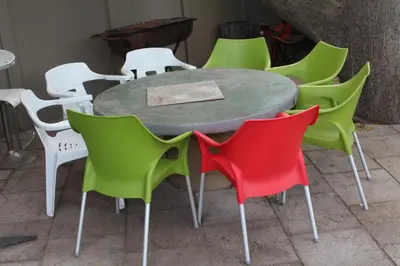a group of chairs around a round table at MO MAJOR in Cape Town