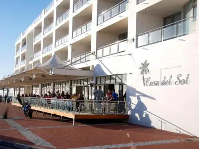 a group of people standing outside of a building at Hibernian Towers 807, Beach Road, Strand in Strand