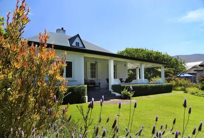 a house with a garden in front of it at Verandah House in Hermanus