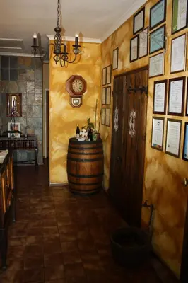 a wine tasting room with a barrel on the wall at The Vinelands on Alpha Guest House in Cape Town
