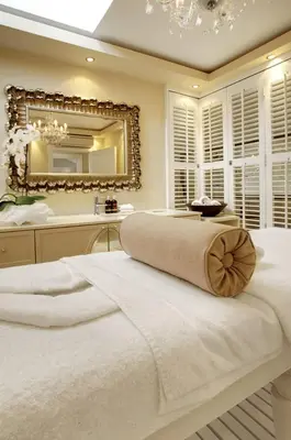 a bedroom with a large bed and a mirror at Banksia Boutique Hotel & Spa in Cape Town