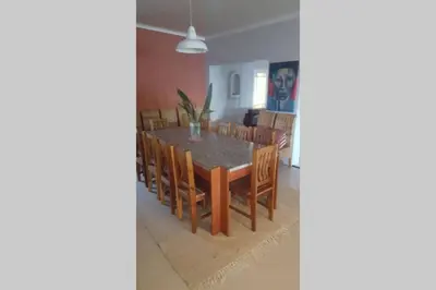 a dining room with a table and chairs at Angel's Place by the Sea in Hermanus