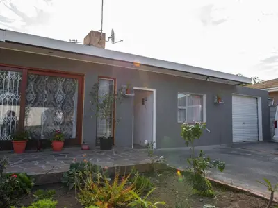 a house with a painting on the side of it at Lyronne Guest house, Shuttle and Tours in Cape Town