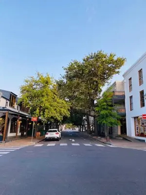 a white car is parked on a city street at Lemon Rind - 205 Oude Hoek in Stellenbosch