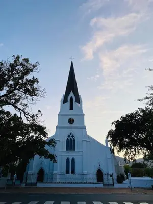 a large white church with a clock tower at Lemon Rind - 205 Oude Hoek in Stellenbosch
