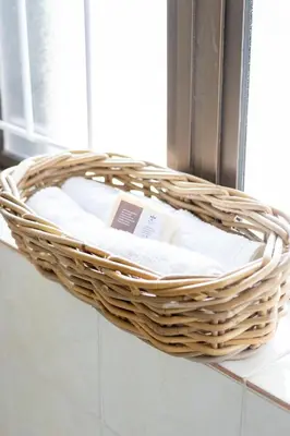 a wicker basket sitting on a counter next to a window at Villa Le Roc Kleinmond Accommodation in Kleinmond