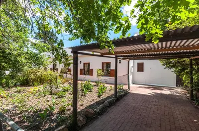 an external view of a house with a brick driveway at GreyCot in Greyton