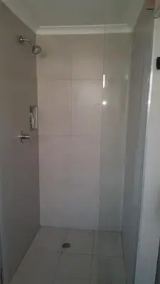 a white shower with a glass door in a bathroom at Hayley's Place in Cape Town
