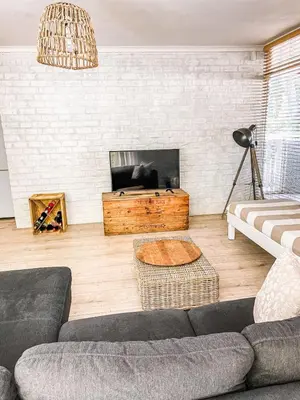 a living room with a couch and a table at At Leisure in Worcester