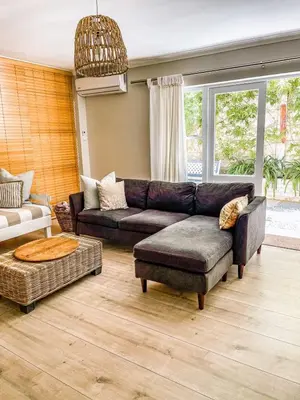 a living room with a couch and a table at At Leisure in Worcester