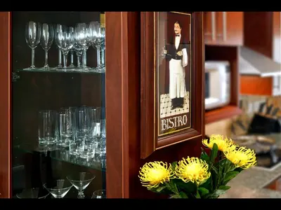 a picture of a woman on a shelf with wine glasses at Sorbonne 1 - No loadshedding in Franschhoek