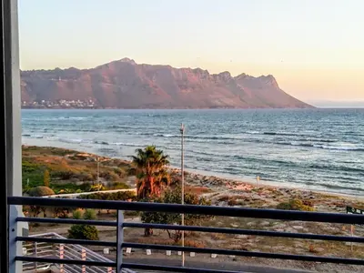 a view of the ocean and mountains from a balcony at OCEANPEARL 209 in Strand