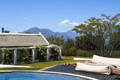 a backyard with a swimming pool and a house at Eikehof Farm in Worcester
