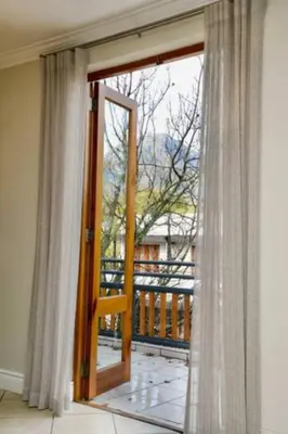 an open door to a balcony with a view at Church Street Luxury Apartments in Stellenbosch