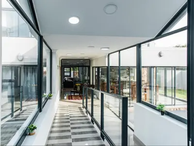 a view of the hallway of a building with glass windows at Elizabeth House in Hermanus