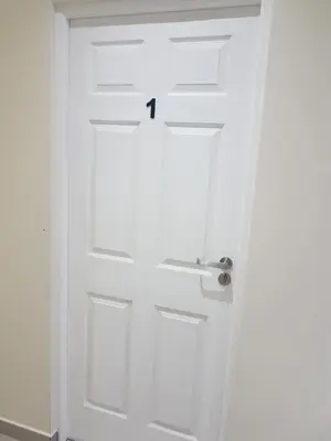 a white door with the number on it at Sharon's House: Modern Self-Catering rooms in Cape Town