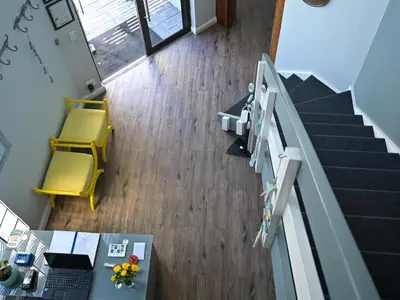an overhead view of a office with a table and yellow chairs at Portico 501 / 904 in Cape Town
