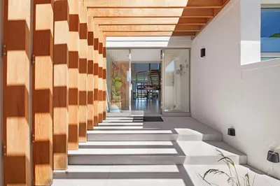 a hallway of a house with wooden walls and stairs at Kite View Villa @2 in Cape Town