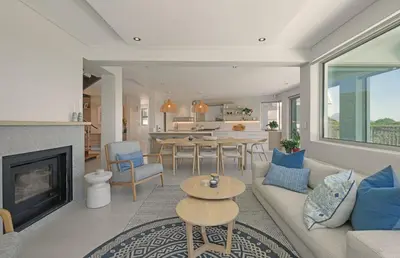 a living room with a couch and a table at Kite View Villa @2 in Cape Town