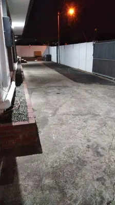 an empty parking lot in a building at night at MJ ACCOMODATION in Cape Town