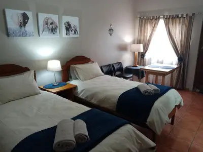 a hotel room with two beds with towels on them at Kleine Nessie in Worcester