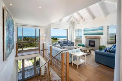 a living room with a view of the ocean at Splendour Hermanus in Hermanus