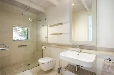 a bathroom with a sink and a toilet and a shower at Splendour Hermanus in Hermanus