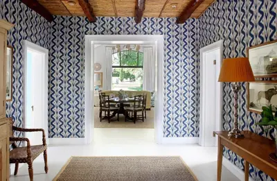 a dining room with blue and white wallpaper at Tugela in Franschhoek