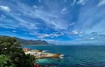 an island in the middle of a large body of water at Hemel in Hermanus Three bedroom Home in Hermanus