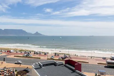 a view of the beach and the ocean at Horizon Bay 301 by CTHA in Bloubergstrand