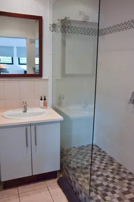 a bathroom with a sink and a shower at Concord Modern Apartment in Stellenbosch in Stellenbosch