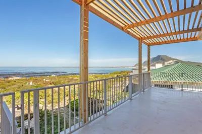 a view of the ocean from the balcony of a house at Blueview on Silversand in Clareport