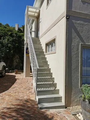 a set of stairs leading to a building at Protea Suite in Bellville