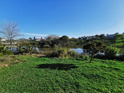 a view of a river from a field of grass at Protea Suite in Bellville