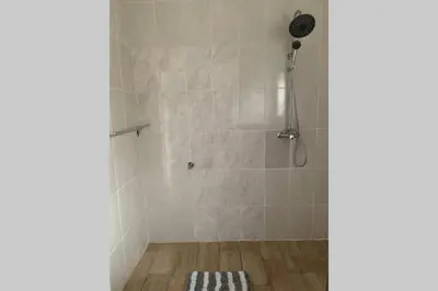 a bathroom with a shower with a shower at Le Grec Wine Tram Apartment #3 in Franschhoek